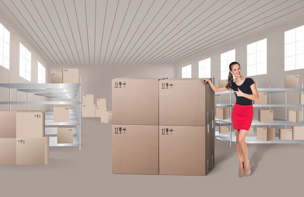 Young woman in warehouse — Stock Photo, Image