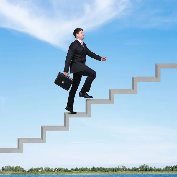 Businessman walking upstairs — Stock Photo, Image