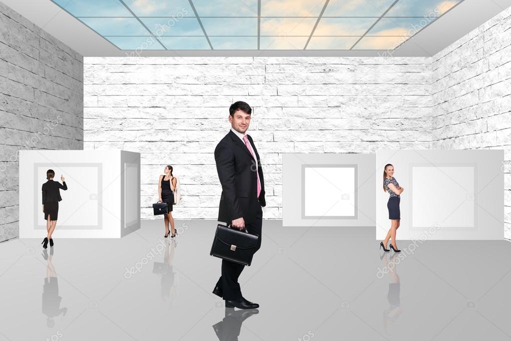 Business people walking on art gallery