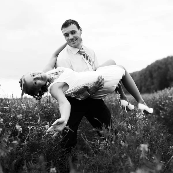 Groom carry a bride — Stock Photo, Image