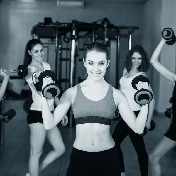 Smiling trainer in front of group — Stock Photo, Image