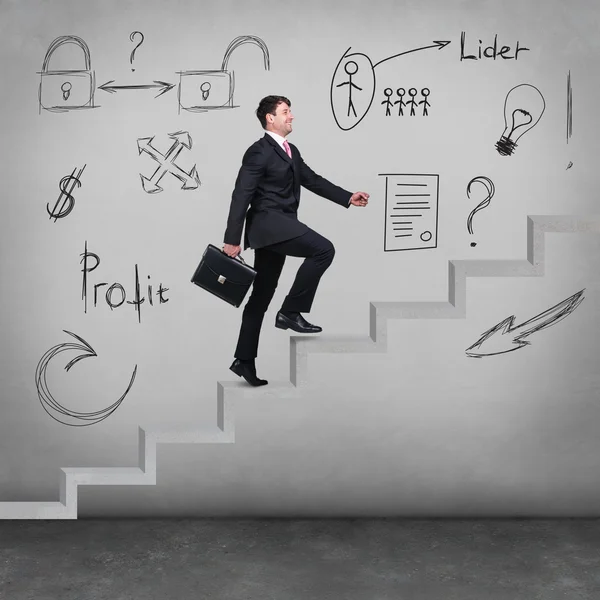 Businessman walking upstairs — Stock Photo, Image