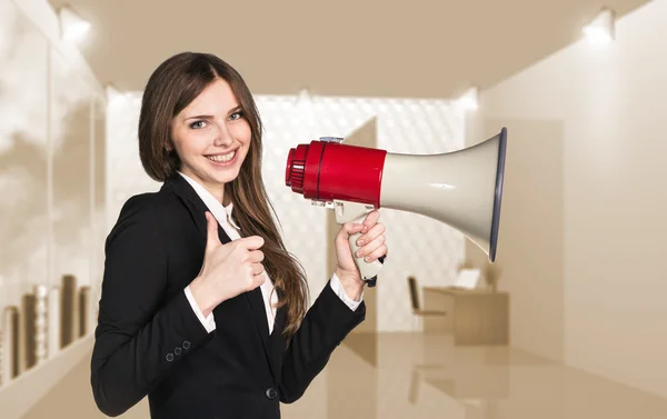 Smiling businesswoman with megaphone — Stock Photo, Image