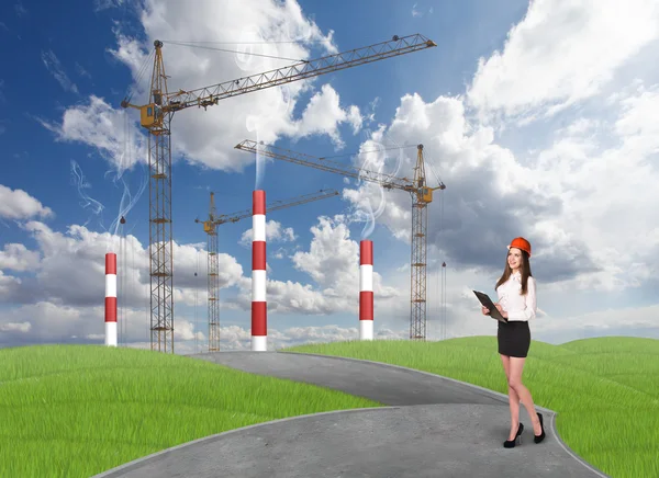Businesslady in front of a factory — Stock Photo, Image