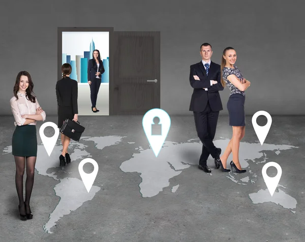 Businesspeople on a map — Stock Photo, Image