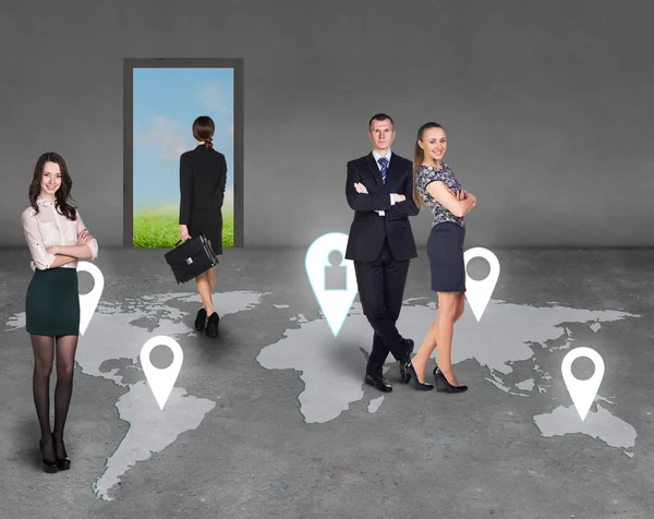 Businesspeople on a map — Stock Photo, Image