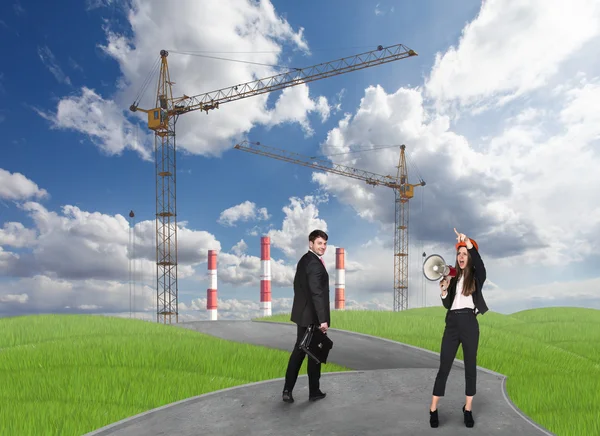 Business people in front af a factory — Stock Photo, Image