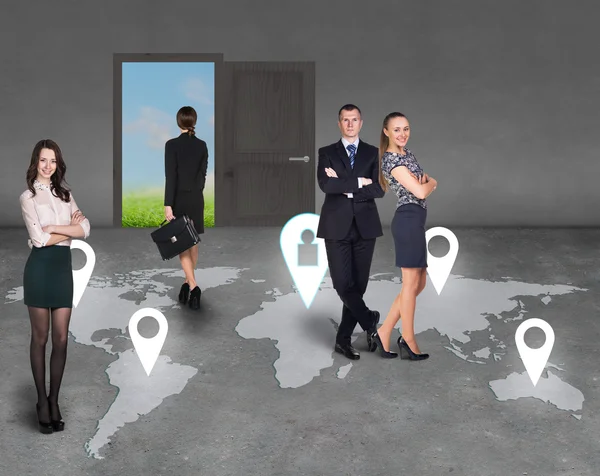 Businesspeople on a map — Stock Photo, Image