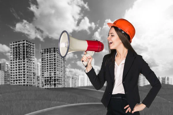 Woman in hardhat with megaphone — Stock Photo, Image