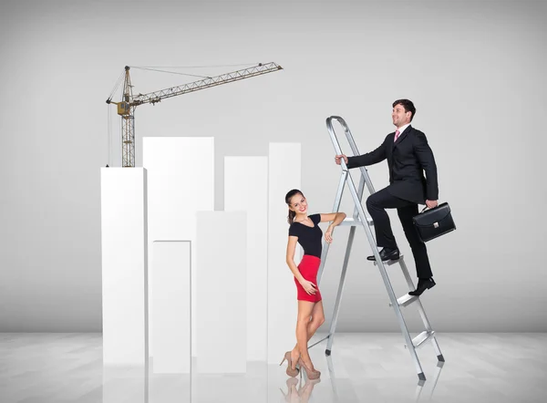Businessman climbing a ladder — Stock Photo, Image