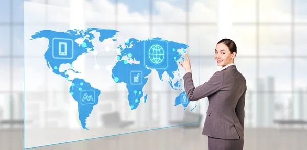 Businesswoman looking to global business map — Stock Photo, Image