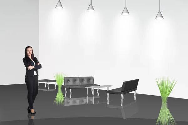 Businesswoman stands in the office hall — Stock Photo, Image