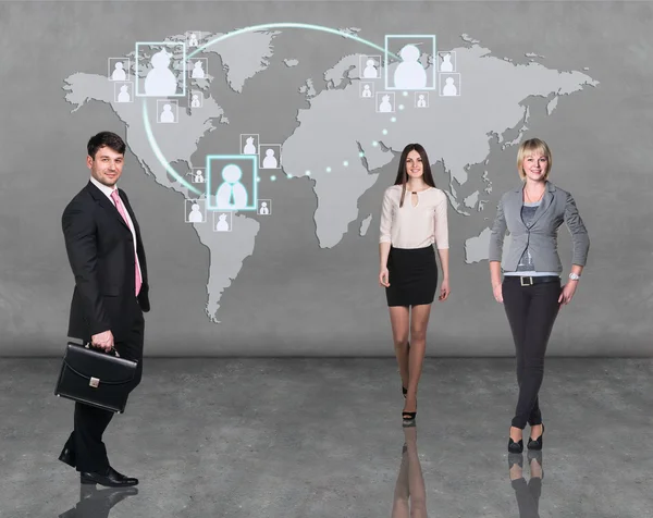 Equipo de gente de negocios con mapa del mundo — Foto de Stock