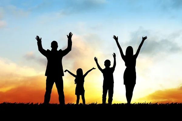 Silhouettes of happy family — Stock Photo, Image