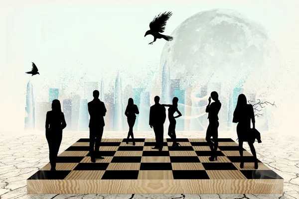 Silhouettes of people on the chess-board — Stock Photo, Image