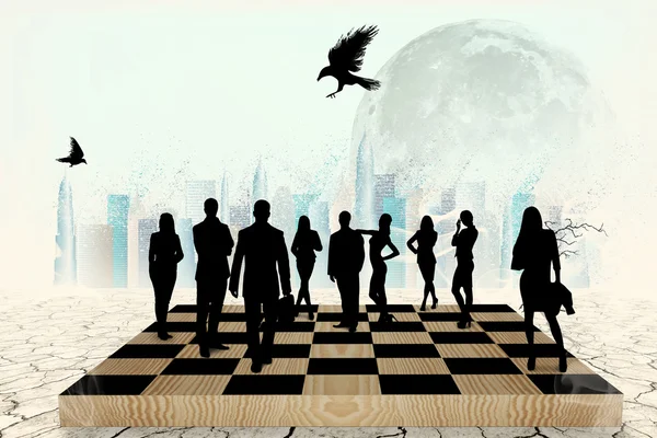 Silhouettes of people on the chess-board — Stock Photo, Image