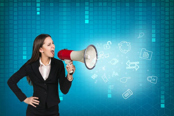 Business woman with megaphone is yelling — Stock Photo, Image