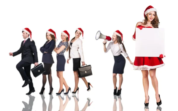 Vrouw in Santa Claus kostuum met mensen uit het bedrijfsleven — Stockfoto
