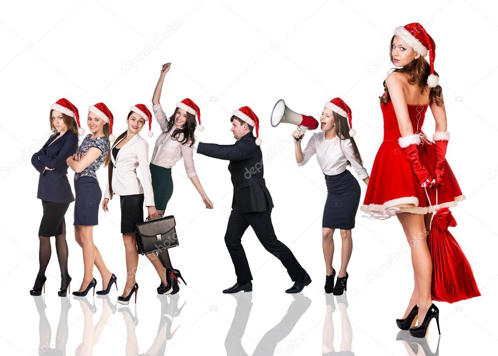 Woman in Santa Claus costume with business people