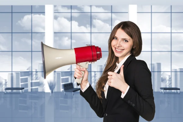 Businesswoman with megaphone and thumbs up — Stock Photo, Image