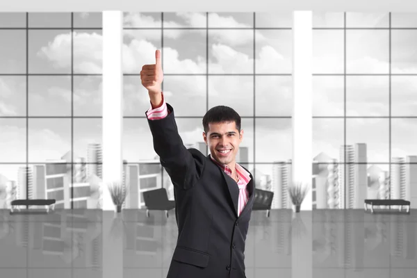 Happy businessman shows thumbs up sign — Stock Photo, Image