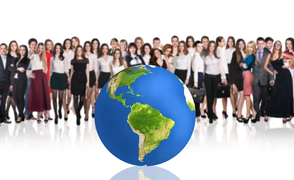 Successful businesspeople beside big earth ball. — Stock Photo, Image