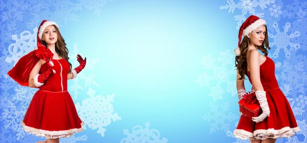 Santa girl stands among snowflakes — Stock Photo, Image