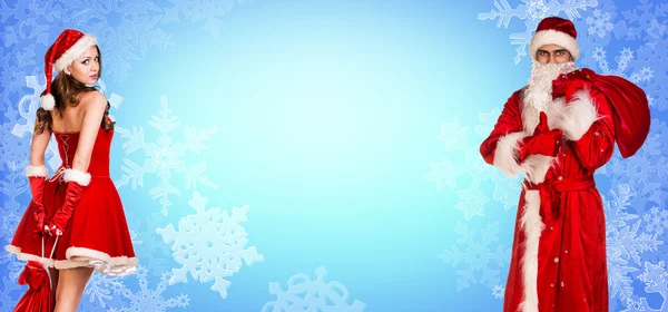 Дед Мороз и рождественская девочка стоят вместе — стоковое фото