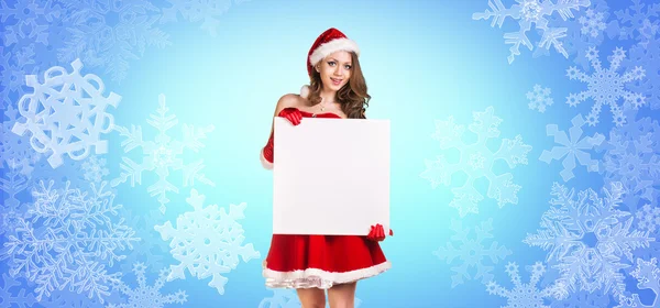 Santa girl stands among snowflakes — Stock Photo, Image