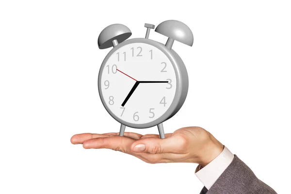 Alarm clock stands on the human palm — Stock Photo, Image