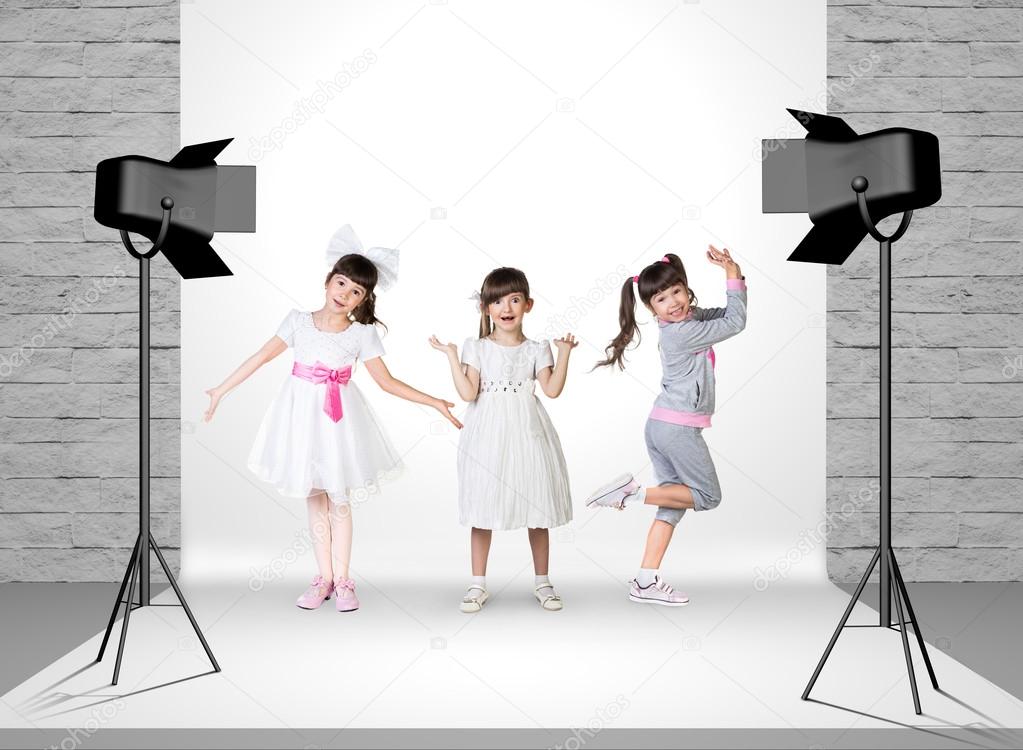 Little girls in photo studio