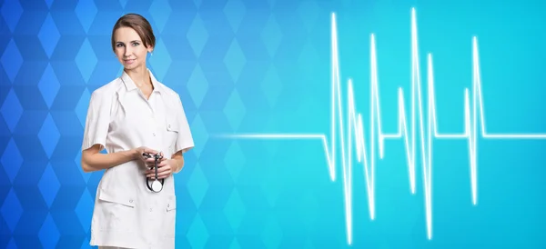 Женщина-врач стоит у линии пульса — стоковое фото