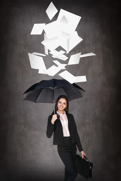 Young business woman throws up paper sheets. — Stock Photo, Image