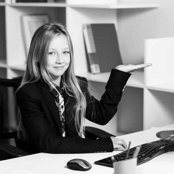 Little girl like business woman at the table — Stock Photo, Image