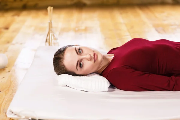 Young woman lying on massage — Stock Photo, Image