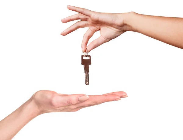 Hand giving a key — Stock Photo, Image