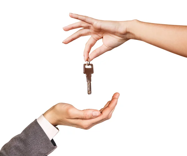 Hand giving a key Stock Photo