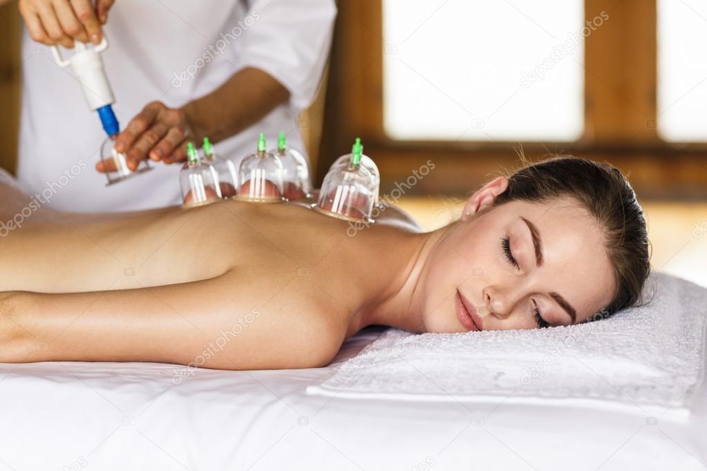 Woman with cupping treatment on back