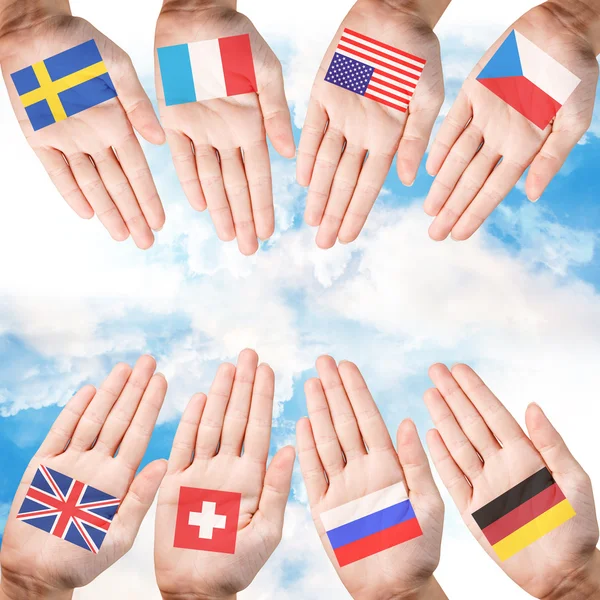 Woman hands with countries flags — Stock Photo, Image