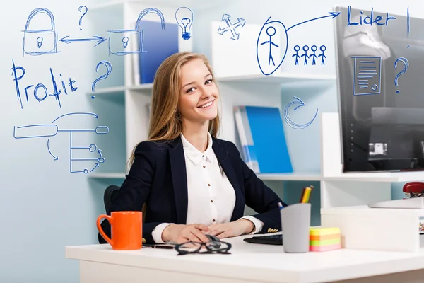 Woman sitting at the desk with computer — Stock Photo, Image