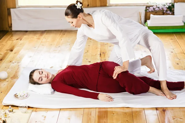 Woman getting thai stretching massage — Stock Photo, Image