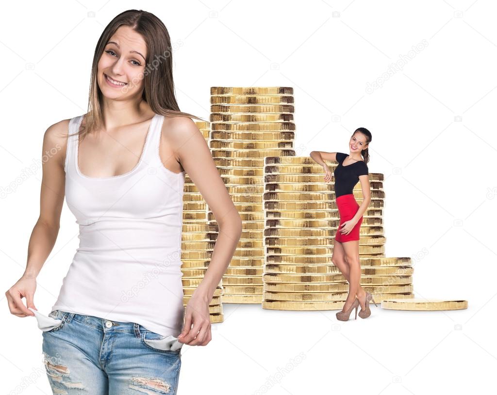 Business women near stack of golden coins