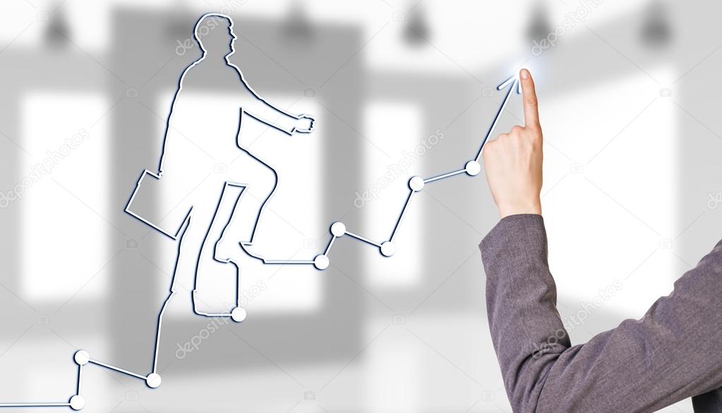 Businesswoman hand drawing a graph