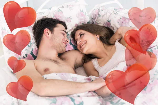 Young couple in bed — Stock Photo, Image