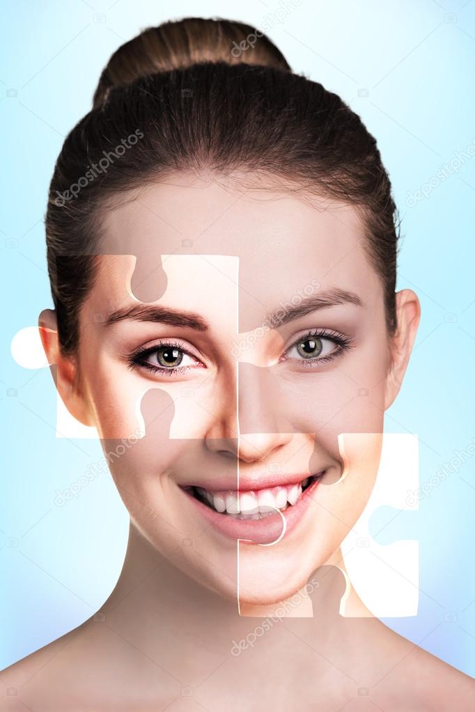 Face of  beautiful young woman with a puzzle parts