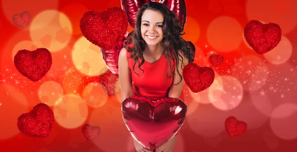 Woman in red dress stands on bokeh background — Stock Photo, Image