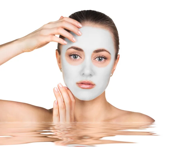 Young woman with clay face mask — Stock Photo, Image