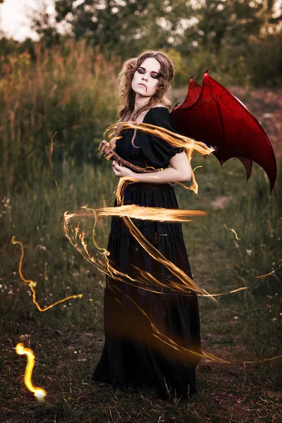 Witch with wings and snake — Stock Photo, Image