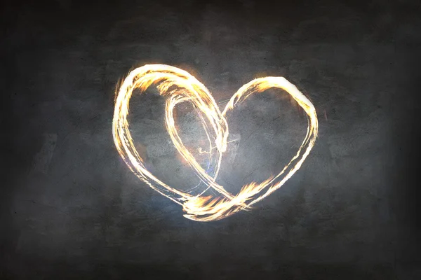 Heart symbol created by fire light — Stock Photo, Image