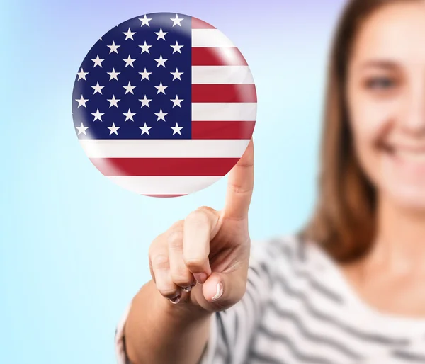 Mujer apuntando a la burbuja con bandera americana — Foto de Stock